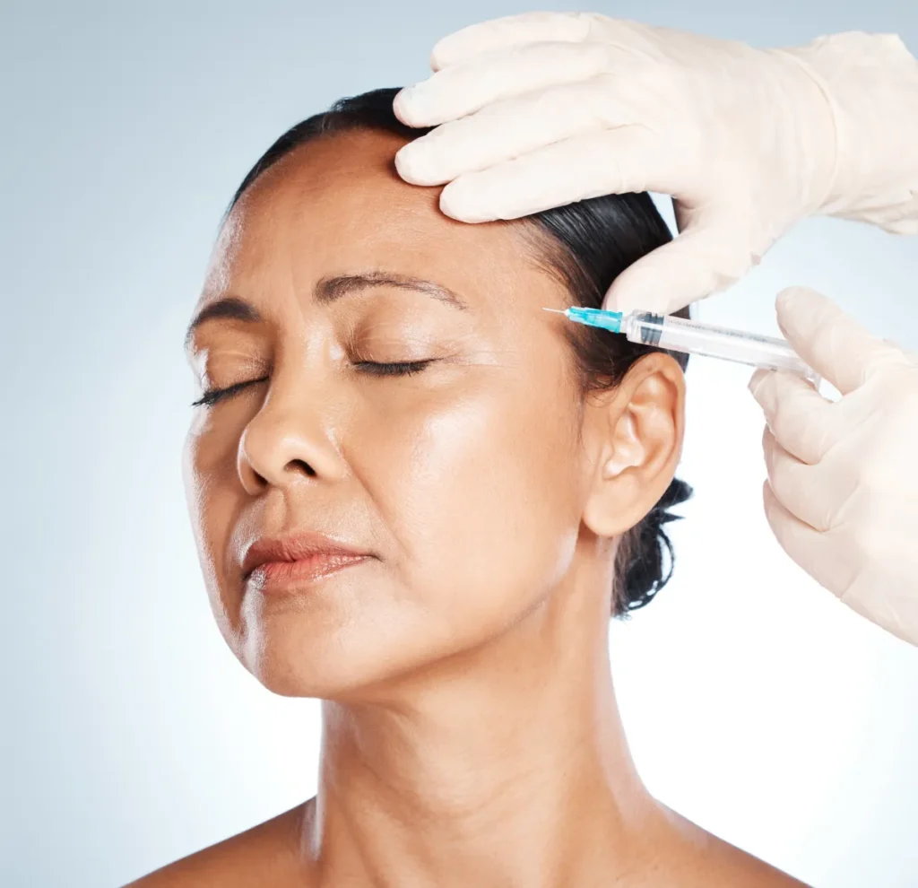 Middle age woman getting Botox or Dysport injection for fine lines | Magnetic Aesthetics | Reno, NV
