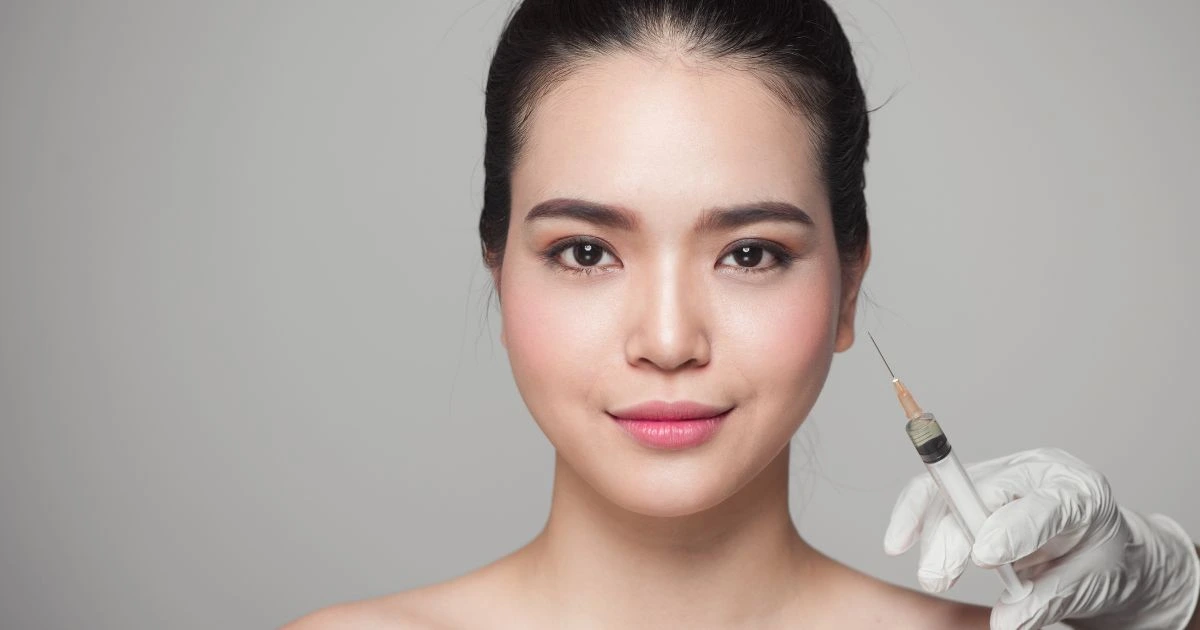 Professional injector performing a precise injection of a wrinkle relaxer Botox, Dysport, or Daxxify.