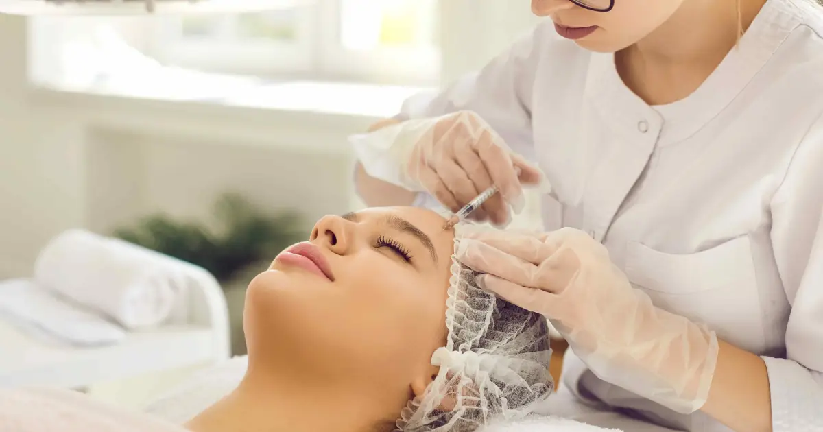 Medical professional administering Sculptra treatment in Reno, NV to a woman